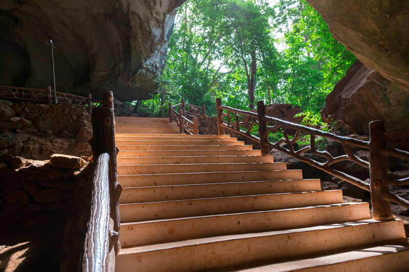 View from inside a stone cave looking out